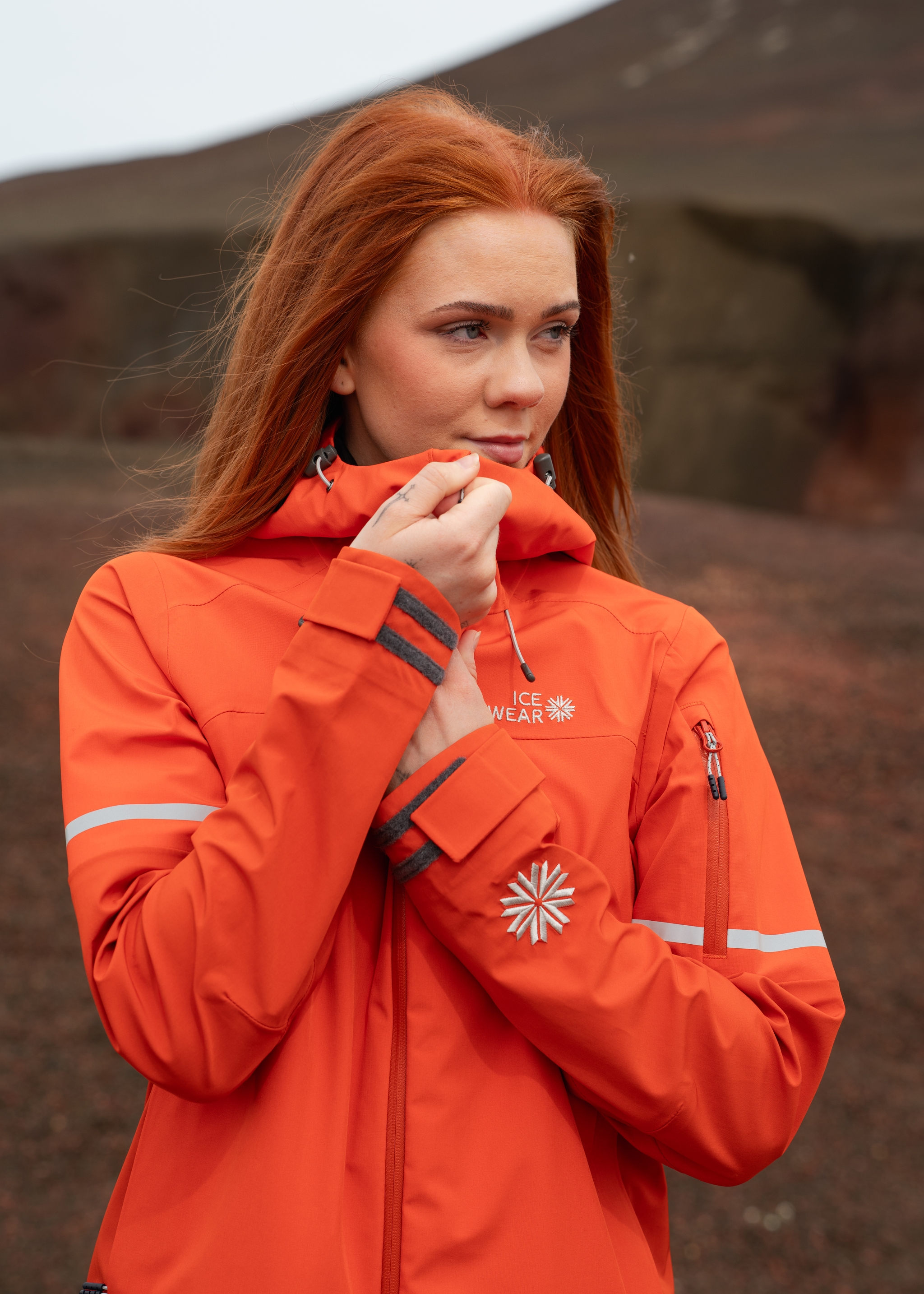 iceland-woman-orange-rainjacket-hardshell_74.jpeg