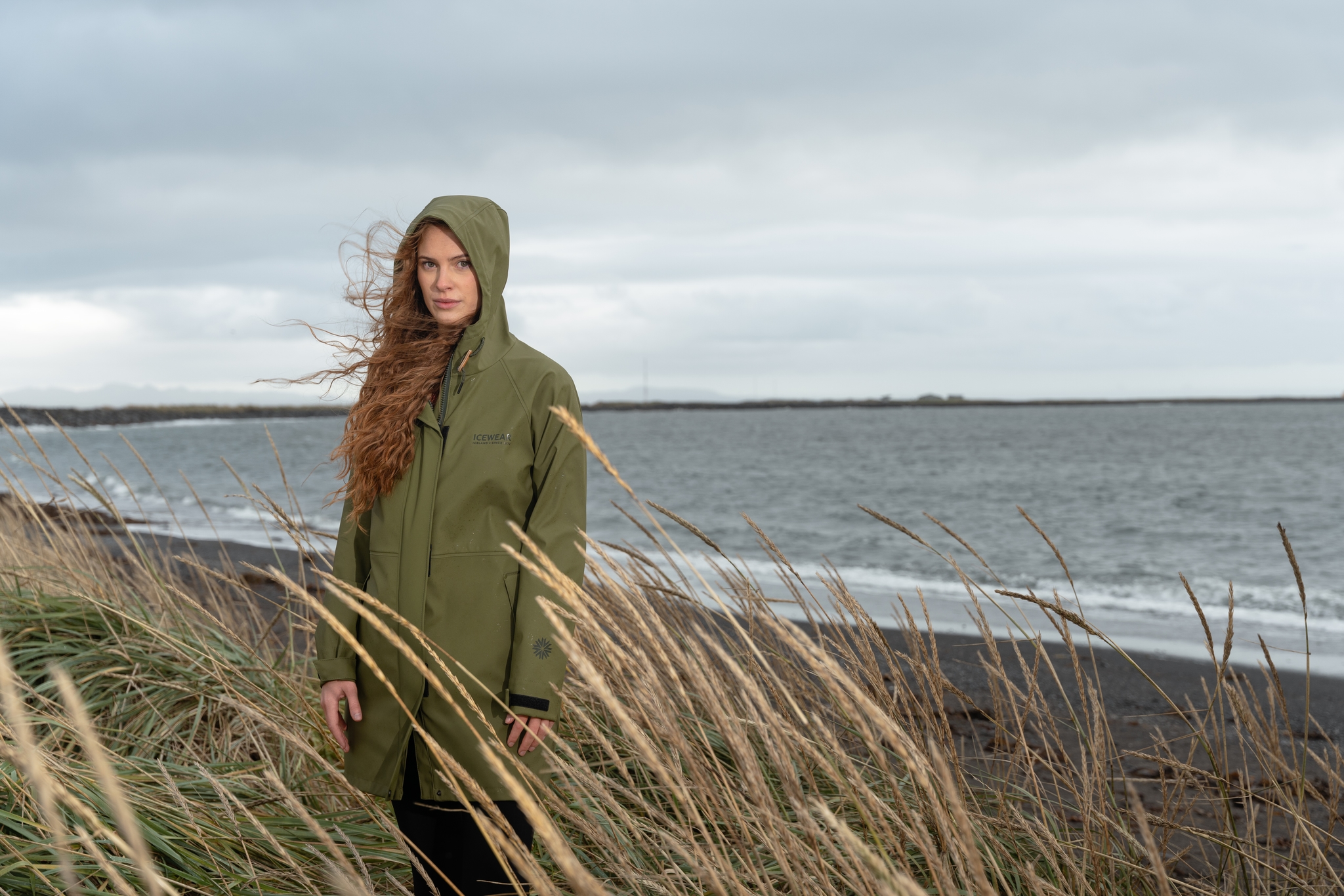 woman-green-raincoat-seashore-18.jpeg