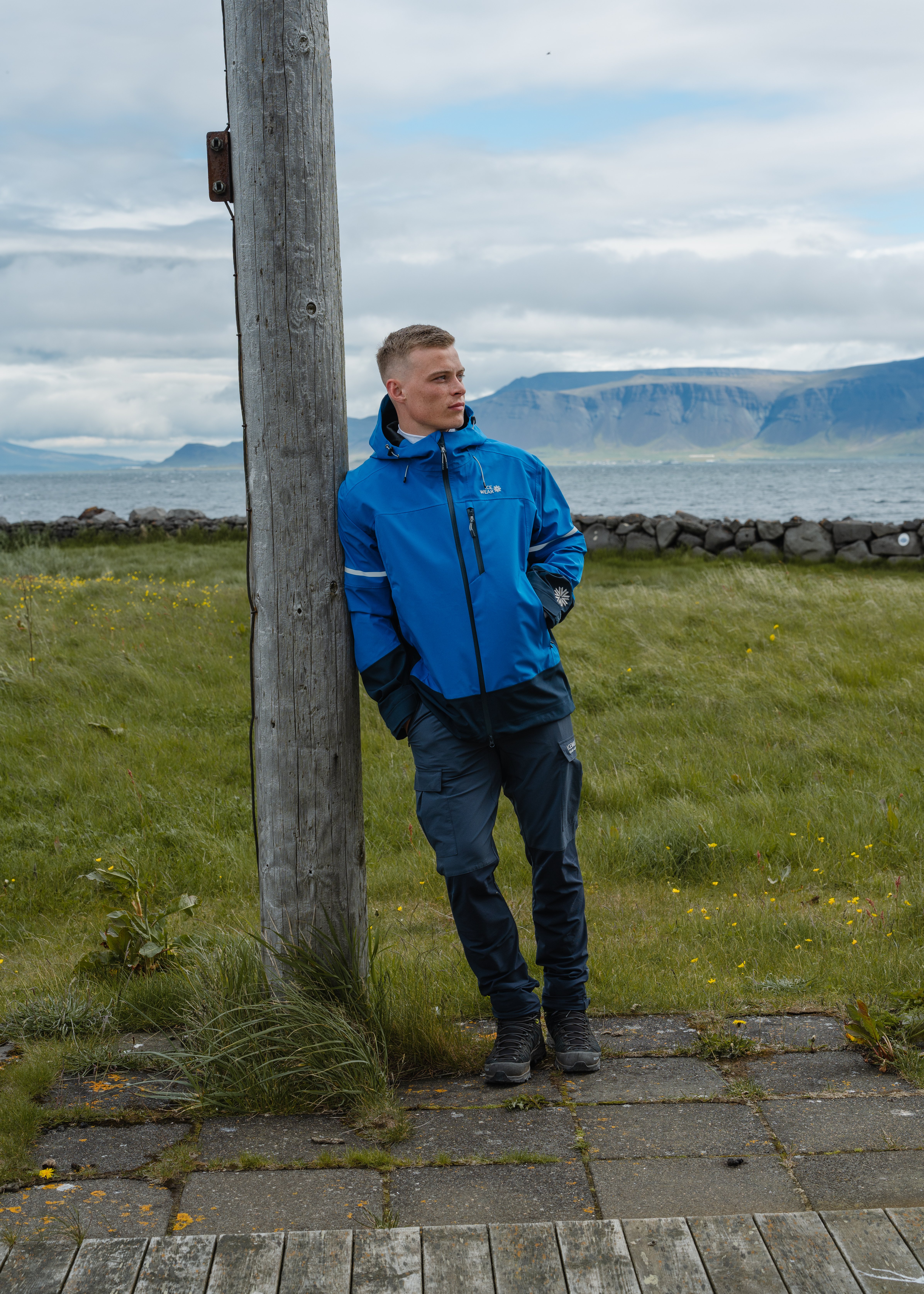 man-blue-jacket-pants-ocean-1.jpeg