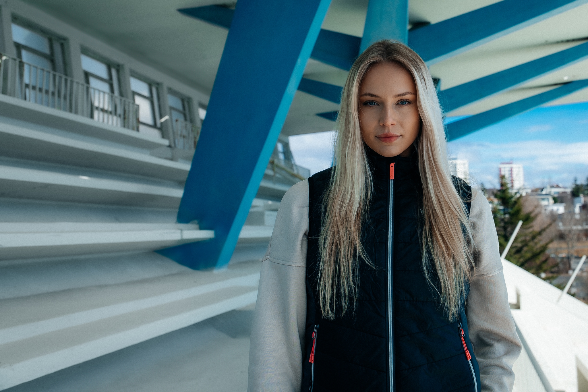 woman-blond-black-vest-outside.jpeg