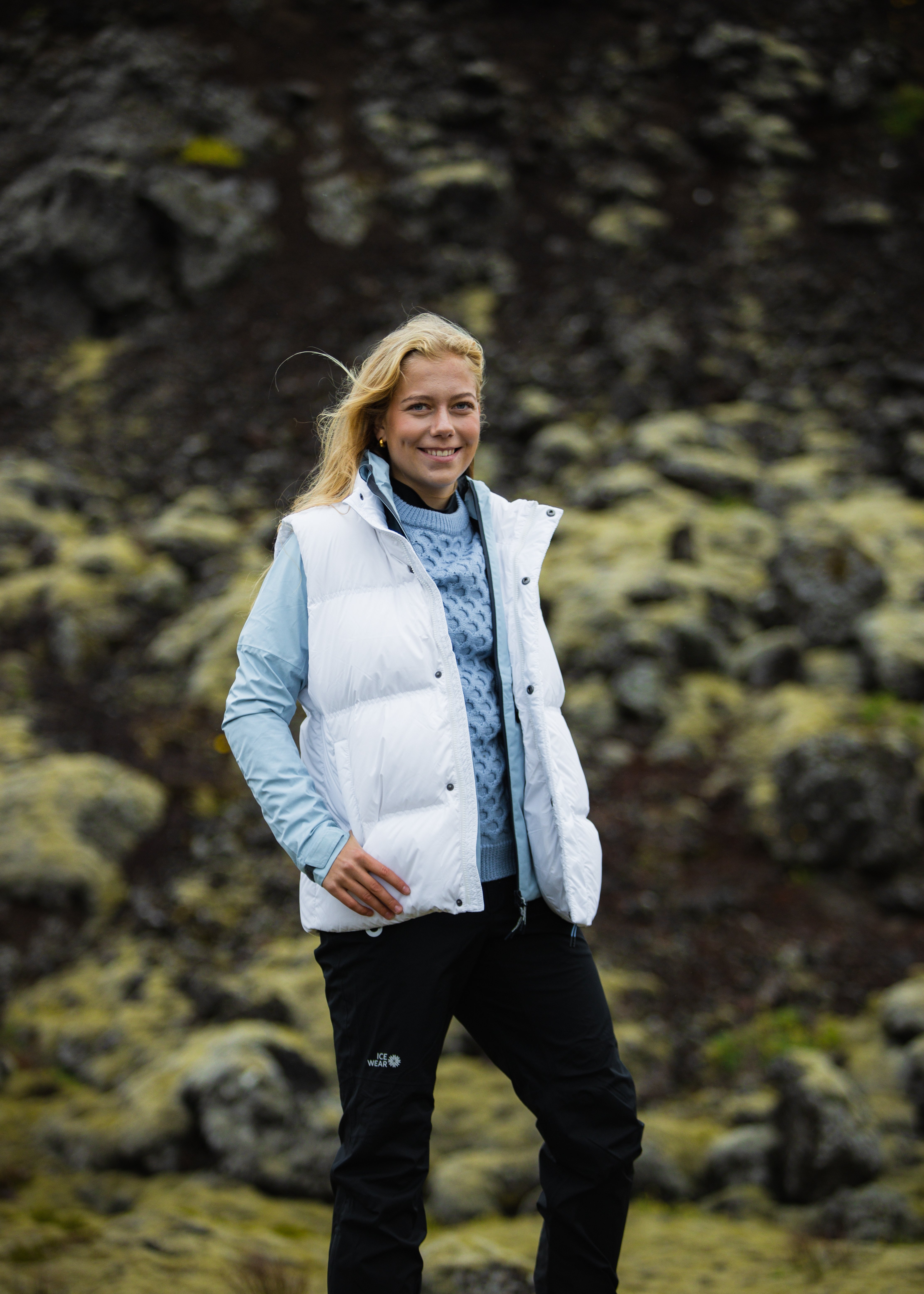 woman-white-downvest-sweater-pants-4.jpeg
