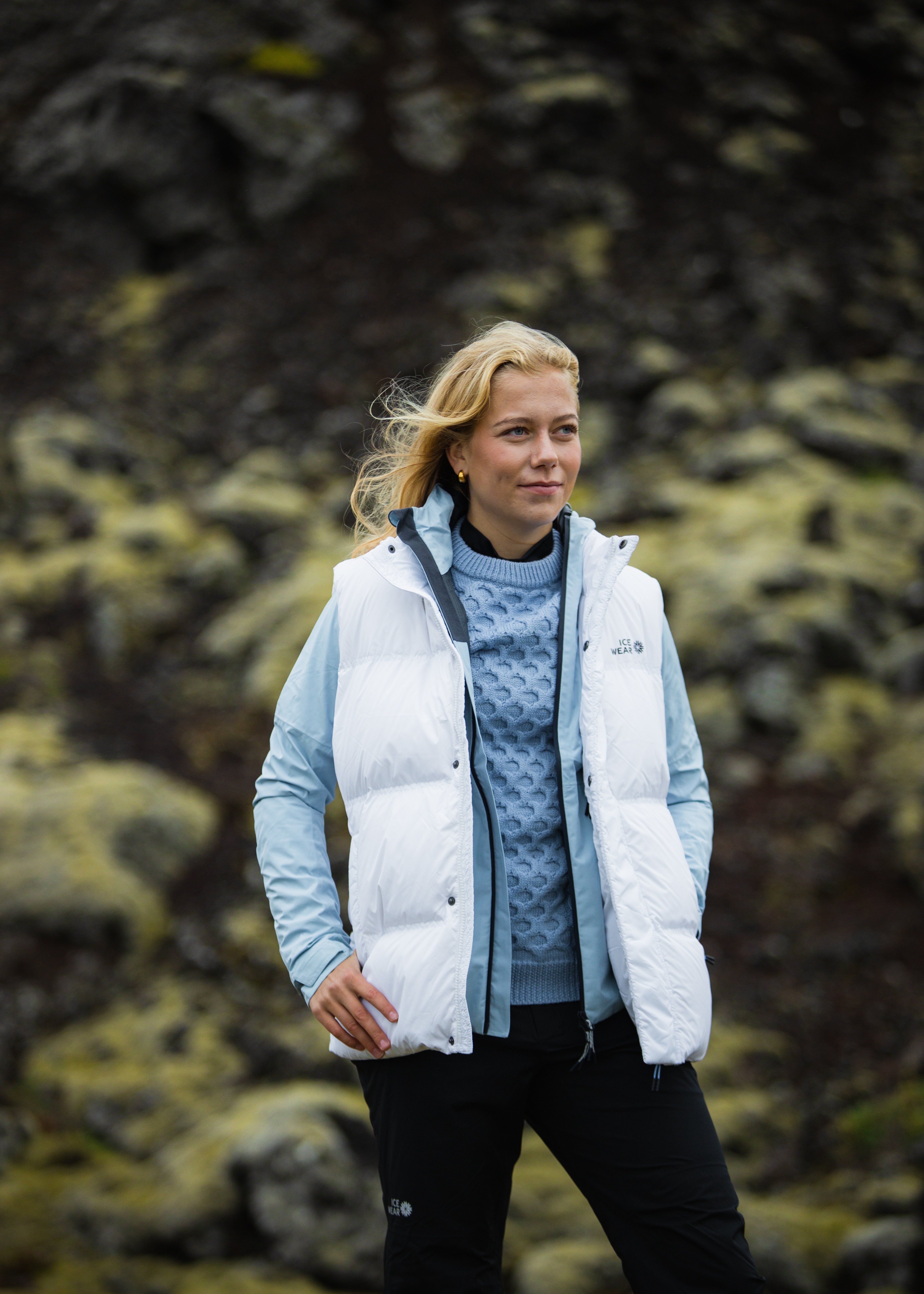 woman-white-downvest-sweater-pants-3.jpeg