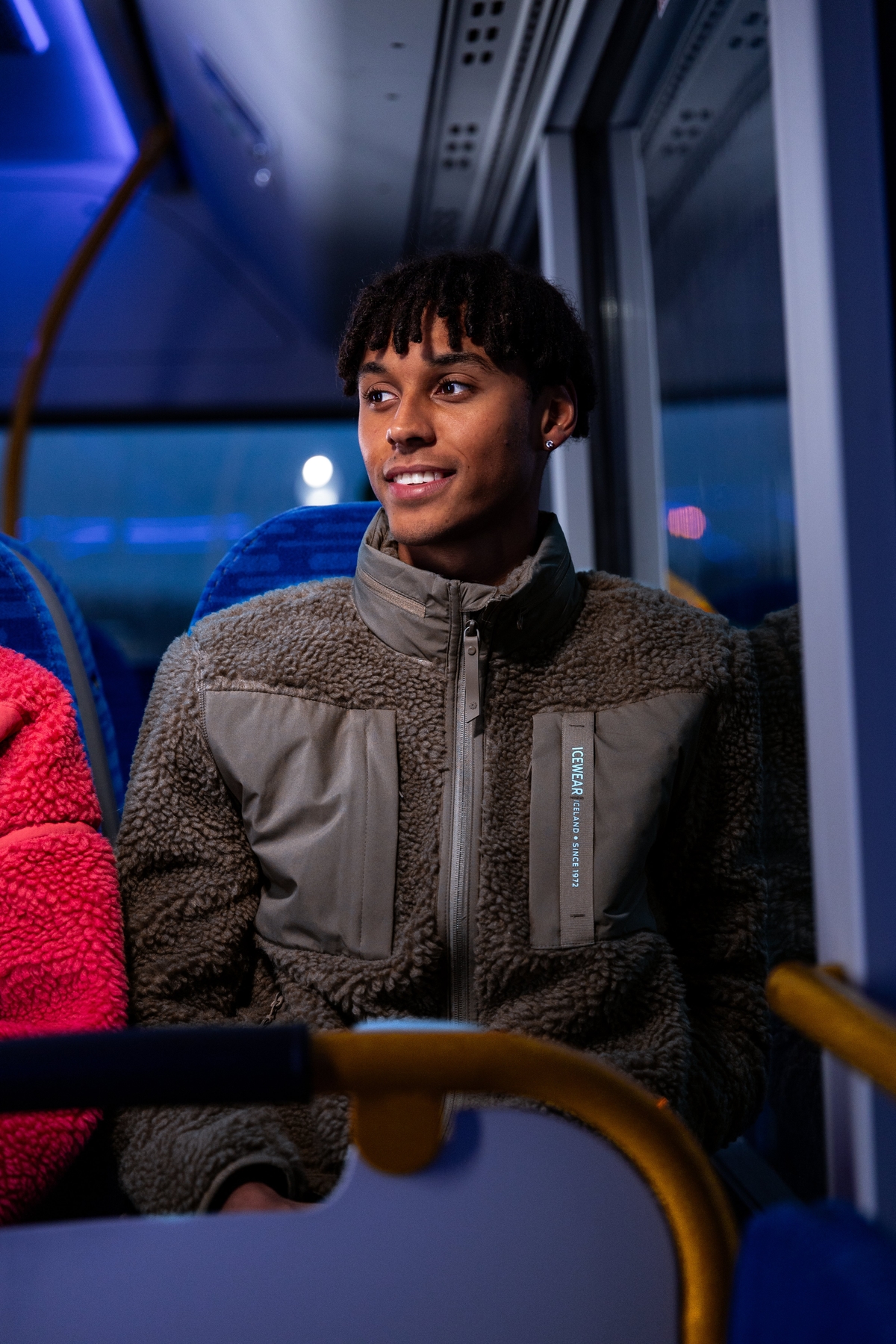 man-brown-sweater-inside-bus.jpeg