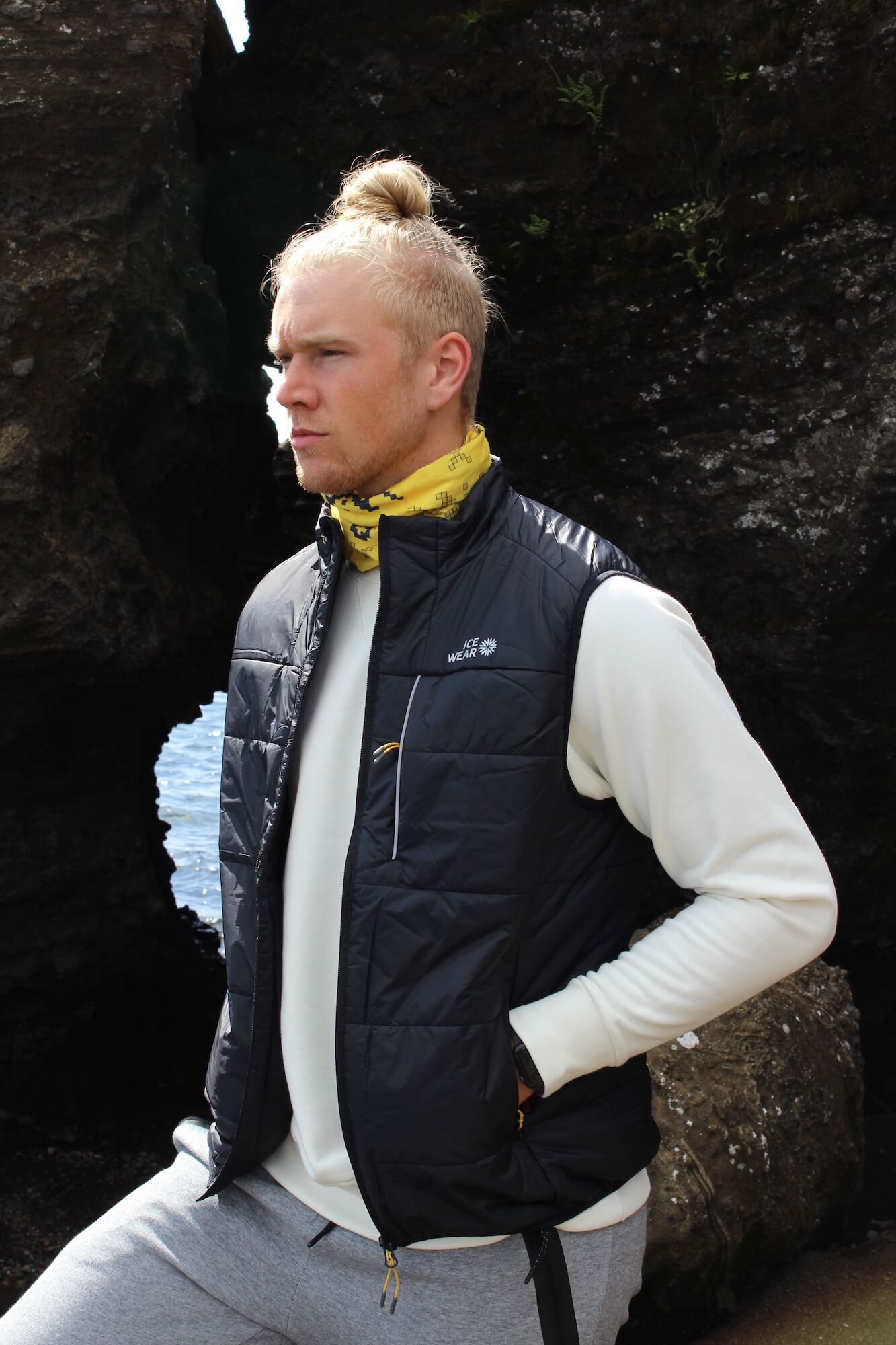 man iceland outdoor rocks with vest